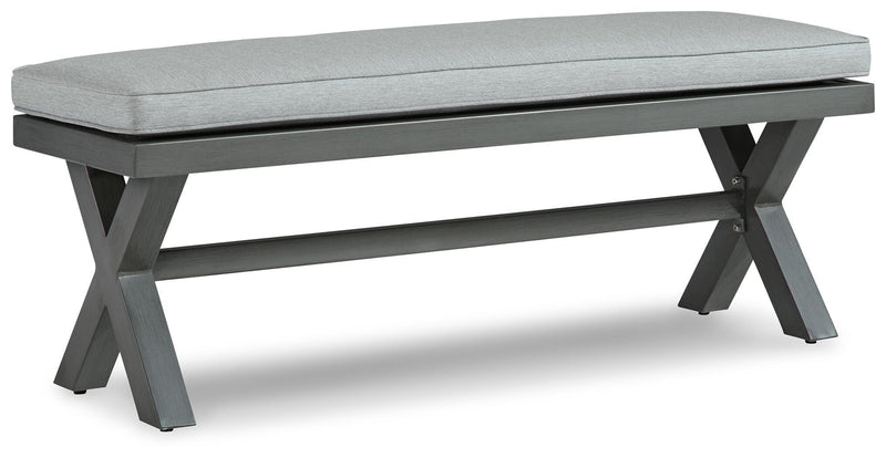 Outdoor dining bench with cushion by Ashley Furniture, featuring a sleek design and sturdy construction for outdoor seating.
