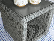 Ashley Furniture Elite Park outdoor end table with a sleek design, perfect for patio or garden use.