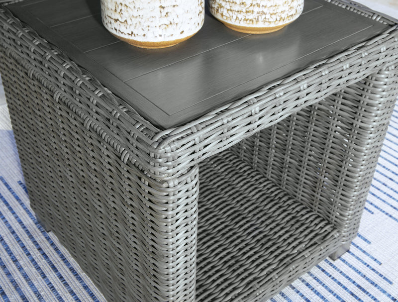 Outdoor table set by Ashley Furniture with four stylish tables featuring metal frames and wooden tops, ideal for outdoor lounging.