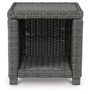 Outdoor table set by Ashley Furniture with a round table and matching chairs, suitable for outdoor seating and gatherings.