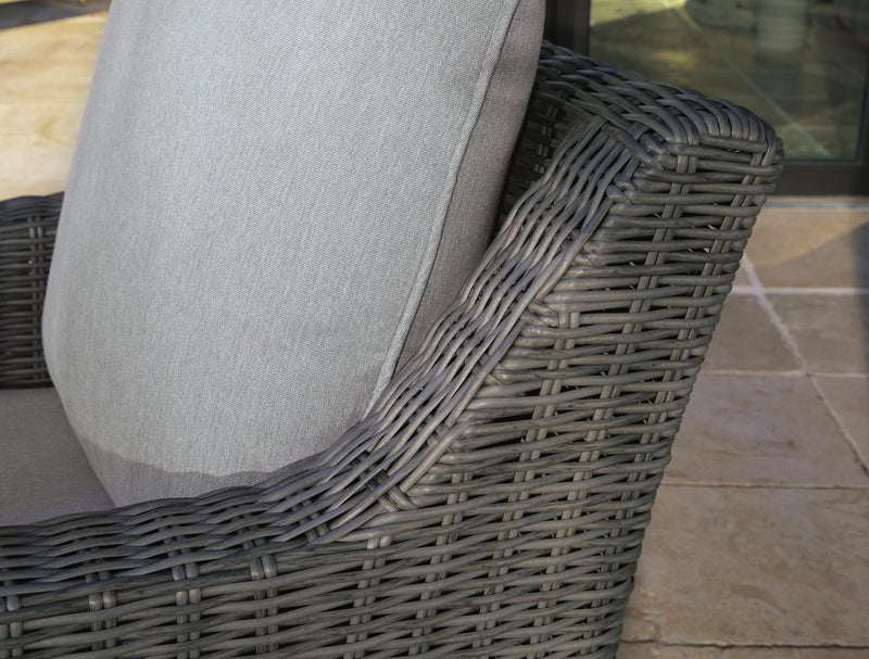 Outdoor swivel lounge chair with cushion from Ashley Furniture, featuring a stylish design and comfortable seating.