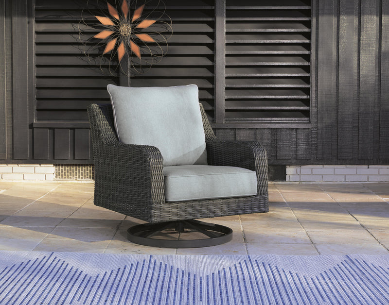 Outdoor swivel lounge chair with cushion by Ashley Furniture, part of Elite Park collection, featuring a stylish and comfortable design.