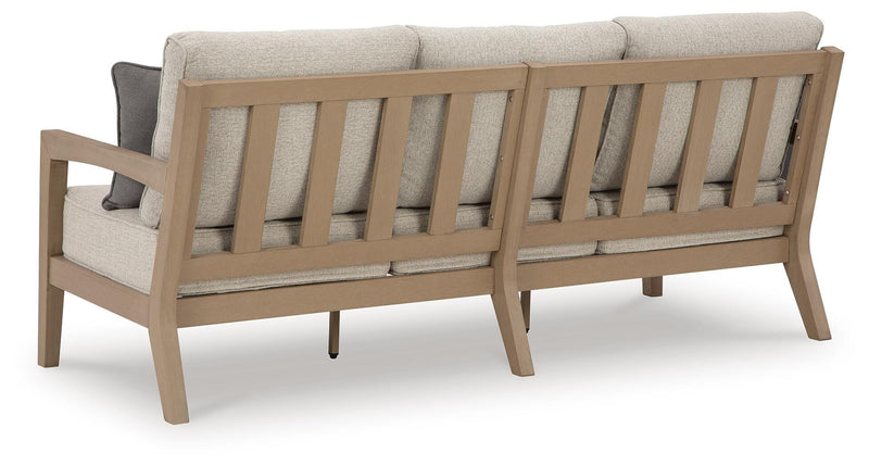 Ashley Furniture Hallow Creek outdoor sofa with cushion, featuring a stylish frame and comfortable seating for outdoor spaces.