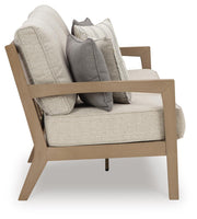 Ashley Furniture Hallow Creek outdoor sofa with cushion, featuring a stylish frame and comfortable seating for outdoor spaces.