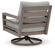 Ashley Furniture Hillside Barn outdoor swivel lounge chair with cushion, featuring a stylish metal frame and comfortable seating.