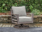 Ashley Furniture Hillside Barn outdoor swivel lounge chair with cushion, featuring a cozy, rustic design and comfortable seating.