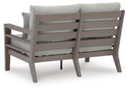 Ashley Furniture hillside barn outdoor loveseat with cushion, featuring a cozy seating area and rustic design for outdoor relaxation.