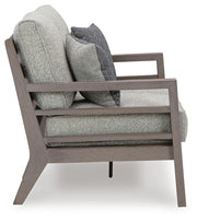 Ashley Furniture Hillside Barn outdoor loveseat with plush cushions, featuring a rustic wooden frame and cozy seating for outdoor spaces.