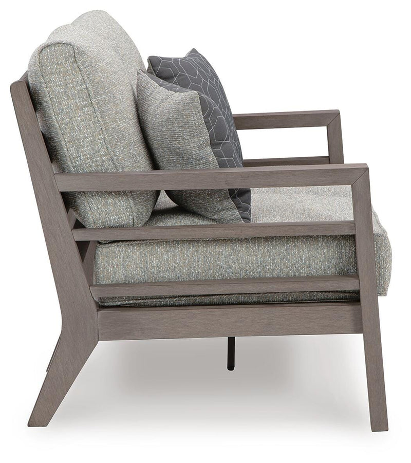 Ashley Furniture Hillside Barn outdoor loveseat with plush cushions, featuring a rustic wooden frame and cozy seating for outdoor spaces.