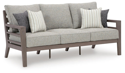 Ashley Furniture Hillside Barn outdoor sofa with matching cushion, featuring a sturdy wooden frame and comfortable seating.