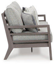 Ashley Furniture Hillside Barn outdoor sofa with cushion, featuring a stylish wooden frame and comfortable seating for outdoor spaces.