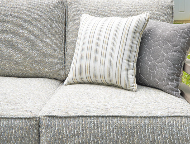 Close-up of the cushion detail on the Ashley Furniture Hillside Barn outdoor sofa, showcasing comfortable seating and stylish fabric.