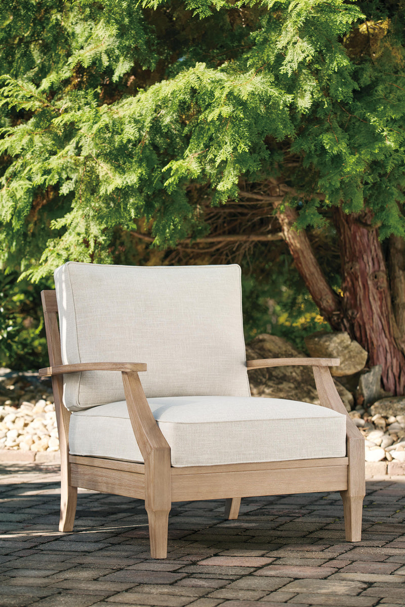 Ashley Furniture Carter Hall outdoor table set with a rectangular table and four matching chairs on a patio.