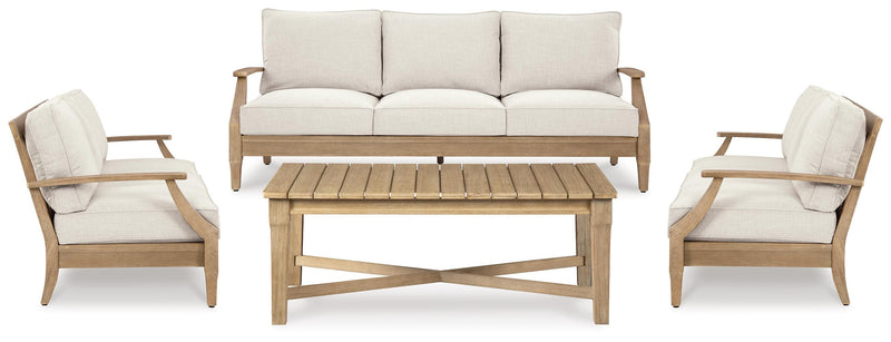 Outdoor table set by Ashley Furniture with a rectangular table and matching chairs, perfect for outdoor dining and entertaining.