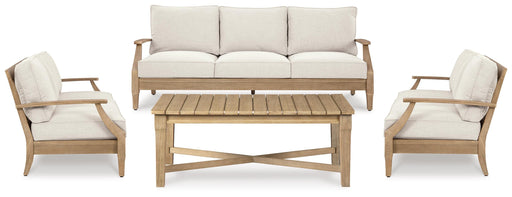 Outdoor table set by Ashley Furniture with a rectangular table and matching chairs, perfect for outdoor dining and entertaining.