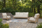 Ashley Furniture Carter Hall outdoor table set with a rectangular table and matching chairs on a patio.