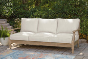 Outdoor table set by Ashley Furniture featuring a sturdy table and matching chairs, ideal for outdoor dining and gatherings.