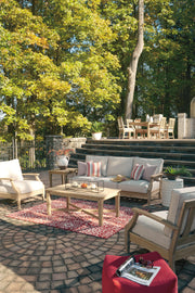 Outdoor table set by Ashley Furniture featuring a sturdy table and matching chairs from the Carter Hall collection.