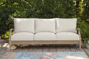 Ashley Furniture Carter Hall outdoor table set with a rectangular table and matching chairs, ideal for patio dining.