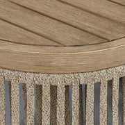 Ashley Furniture Serena Shores outdoor seating set with cushioned chairs and patio table in a scenic outdoor setting