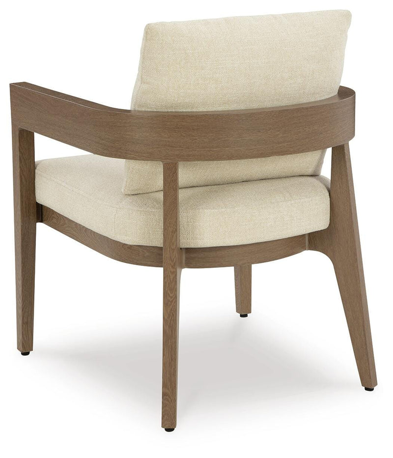 Serene Bay outdoor dining set by Ashley Furniture featuring a table and chairs in a backyard setting