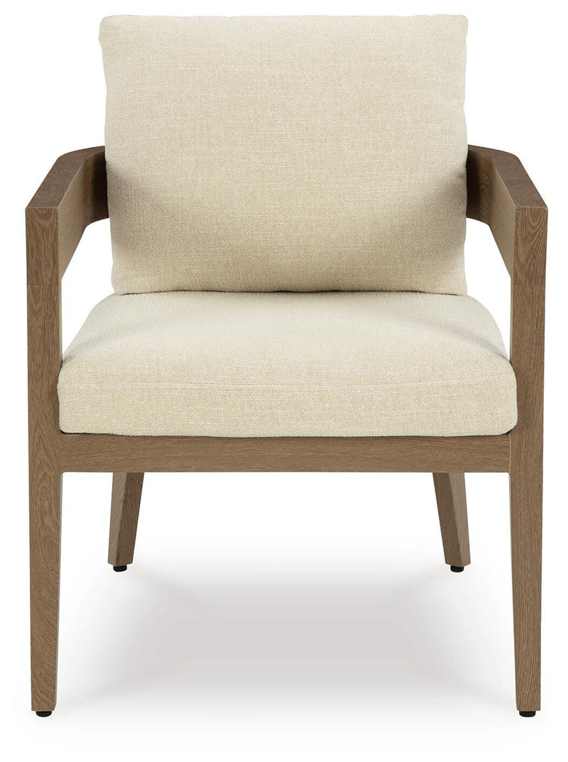 Serene Bay outdoor dining set by Ashley Furniture with a rectangular table and six matching chairs in a garden setting.