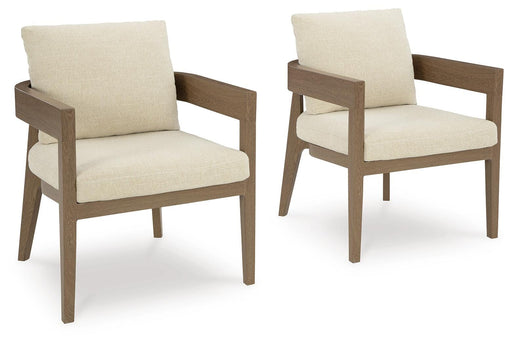Set of two Ashley Furniture Serene Bay outdoor dining arm chairs with cushions, featuring a stylish design and comfortable seating.