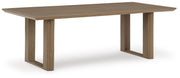 Ashley Furniture Serene Bay outdoor dining set with table and chairs, shown from an angled view in a garden setting.