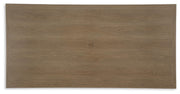 Outdoor dining table with a sleek wooden top and metal legs, part of Ashley Furniture's Serene Bay collection