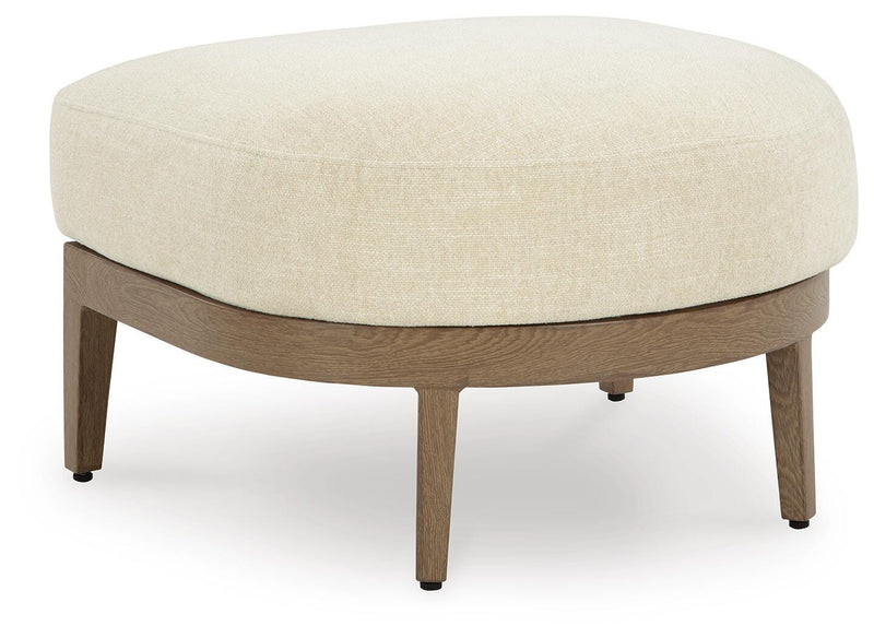 Ashley Furniture Serene Bay outdoor ottoman with cushion, shown from an angled perspective for outdoor seating and relaxation.