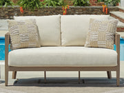 Ashley Furniture Serene Bay outdoor loveseat with cushion, stylish outdoor seating for relaxing in the backyard or patio area.