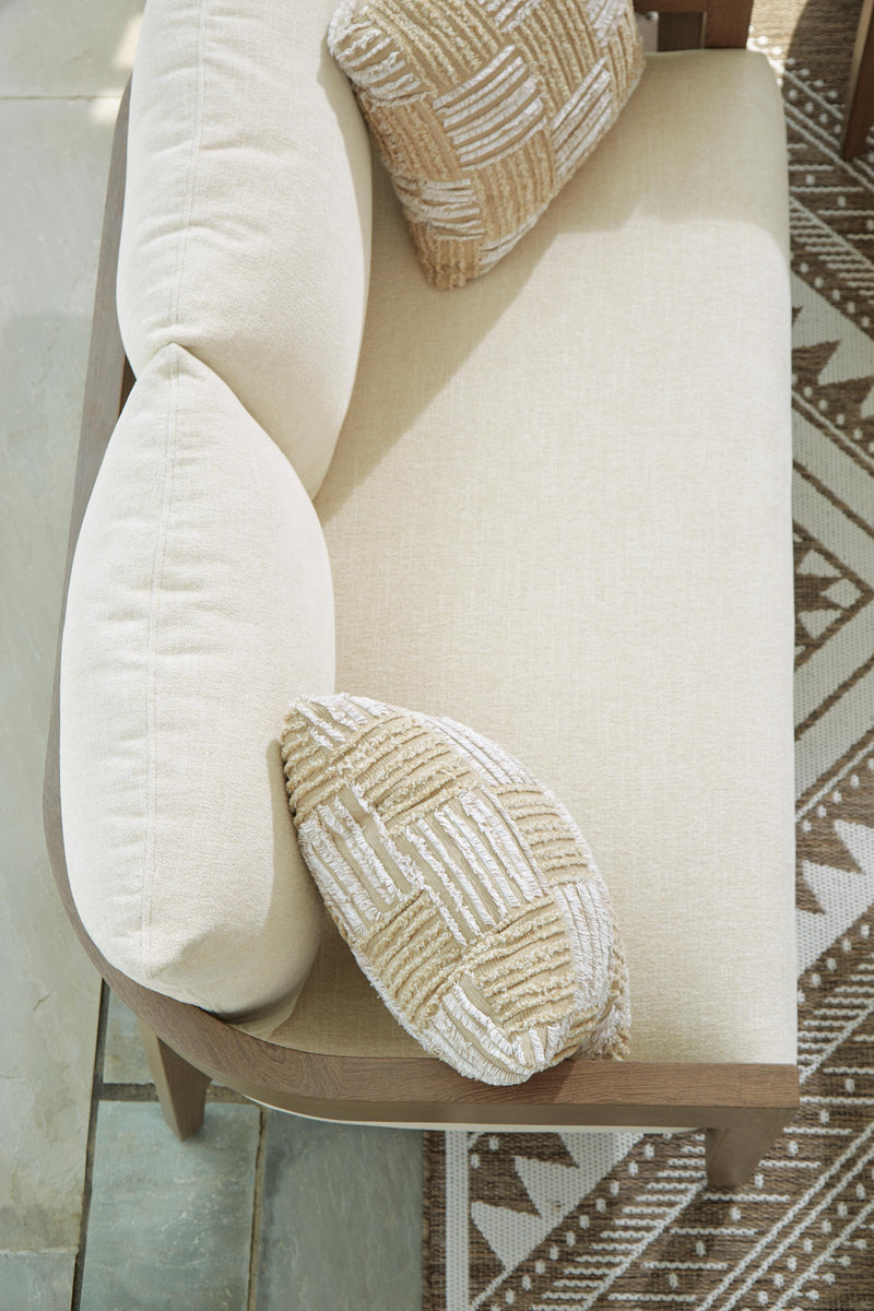 Ashley Furniture Serene Bay outdoor loveseat with plush cushions, featuring a stylish weather-resistant design for comfortable outdoor seating.