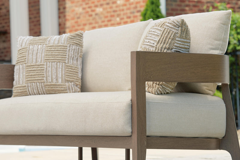 Serene Bay outdoor loveseat with cushion, Ashley Furniture outdoor seating set, featuring plush cushions and weather-resistant wicker design.