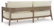 Ashley Furniture Serene Bay outdoor sofa with cushion, featuring plush seating and stylish design for outdoor relaxation.