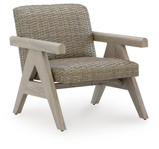 Ashley Furniture Cliff Trails outdoor rocking lounge chair with cushioned seat and backrest, ideal for relaxing outdoors.