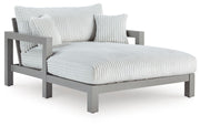 Hurley Park outdoor chaise lounge with cushion by Ashley Furniture, featuring a sleek design and comfortable seating.
