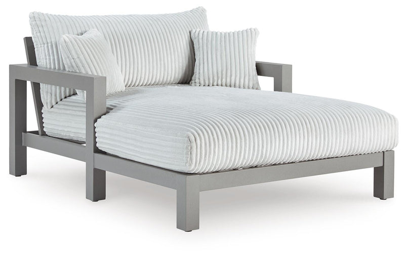 Hurley Park outdoor chaise lounge with cushion by Ashley Furniture, featuring a sleek design and comfortable seating.