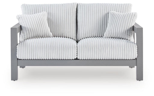 Hurley Park outdoor loveseat with cushion by Ashley Furniture, featuring a cozy seating area and stylish design for outdoor spaces.