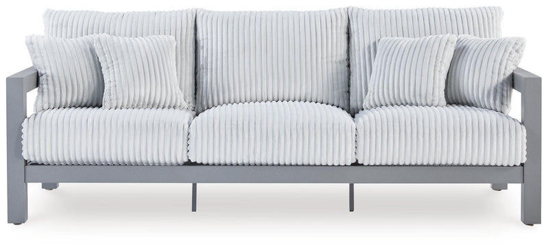 Hurley Park outdoor sofa by Ashley Furniture with a cushion, featuring a sturdy frame and comfortable seating for outdoor relaxation.