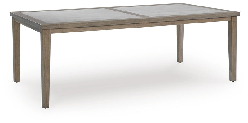 Ashley Furniture Rainier Ranch outdoor dining table with sturdy wooden top and metal legs, shown from an angled view.