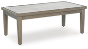 Outdoor cocktail coffee table from Rainier Ranch by Ashley Furniture, featuring a wooden top and sturdy design for outdoor use.