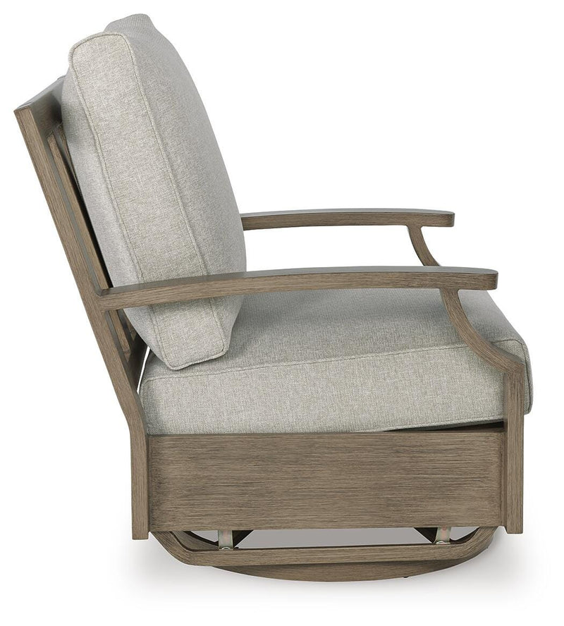 Ashley Furniture Rainier Ranch outdoor swivel glider chair with cushion, featuring a sturdy frame and comfortable seating for outdoor lounging.