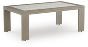 Ashley Furniture Kimpton Isle outdoor cocktail table with a round wooden top and metal frame, perfect for patio or garden spaces.