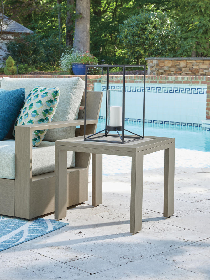 Ashley Furniture Kimpton Isle outdoor end table with slatted top and sturdy frame, perfect for patio or garden decor.