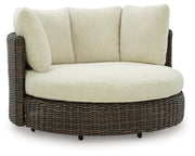 Ashley Furniture Kimora outdoor swivel lounge chair with cushion, featuring a stylish frame and comfortable seating for outdoor relaxation.