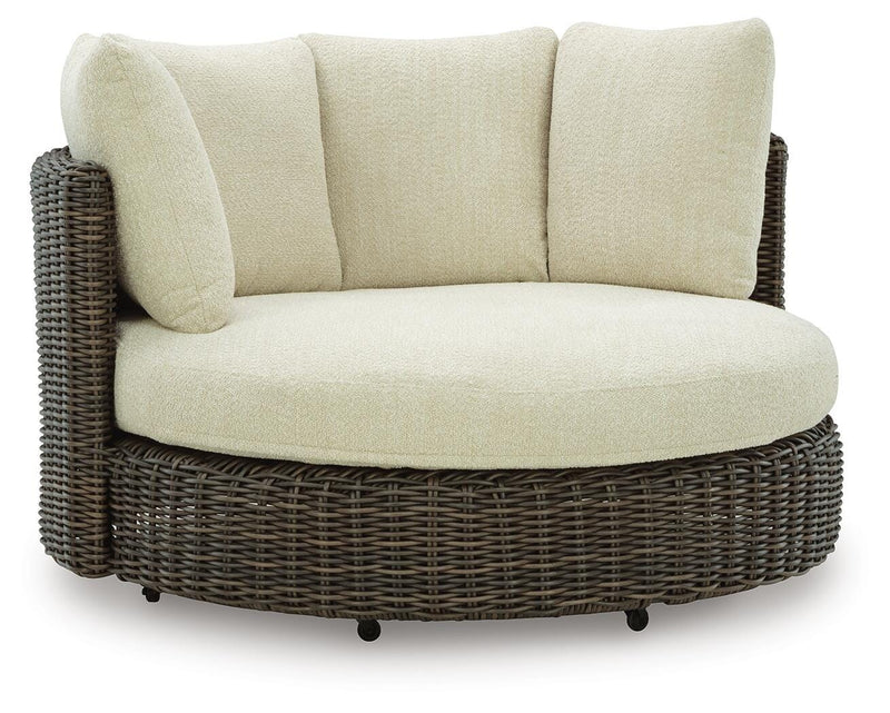 Ashley Furniture Kimora outdoor swivel lounge chair with cushion, featuring a stylish frame and comfortable seating for outdoor relaxation.