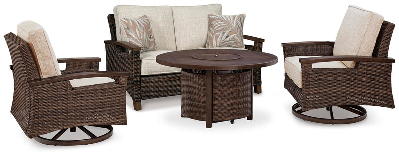 Outdoor table set with Ashley Furniture Paradise Trail loveseat, lounge chairs, and fire pit table in a cozy outdoor setting.