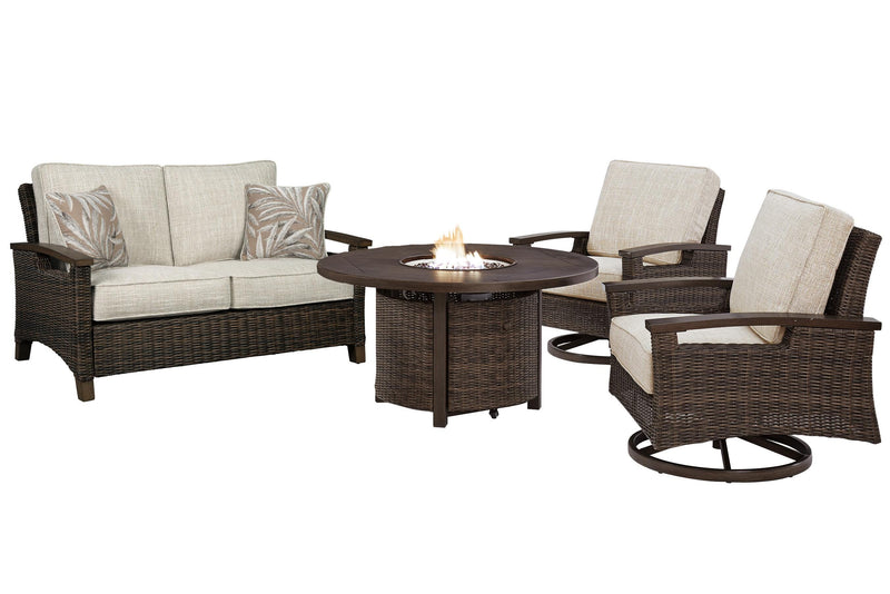 Outdoor Ashley Furniture Paradise Trail loveseat, lounge chairs, and fire pit table set for patio relaxation.