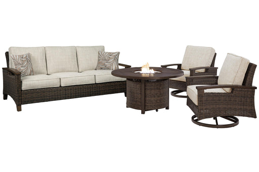 Ashley Furniture Paradise Trail outdoor sofa, lounge chairs, and fire pit table set for patio relaxation.