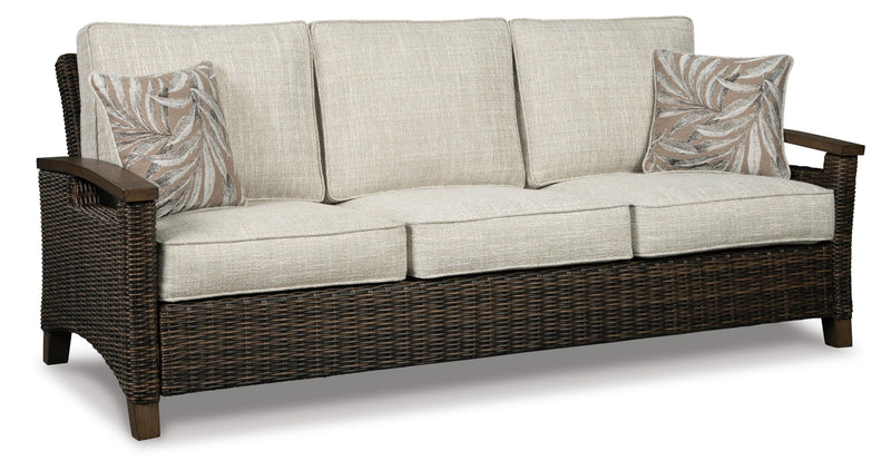 Ashley Furniture Paradise Trail outdoor sofa, lounge chairs, and fire pit table set with cushioned seating and modern design.